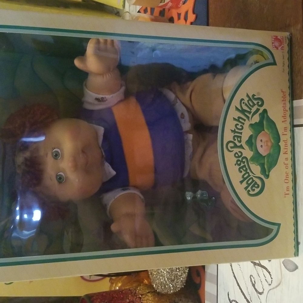 Cabbage patch kids boy..brown yarn hair..green eyes...nib